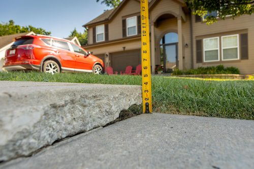 Tape Measure on Uneven Sidewalk | Pro Polyjacking