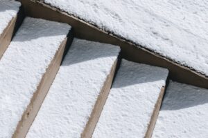 Cracked Concrete - image of snow covered concrete steps