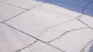 Image of cracked concrete that needs concrete repair