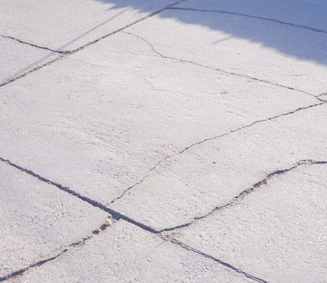 Image of cracked concrete that needs concrete repair