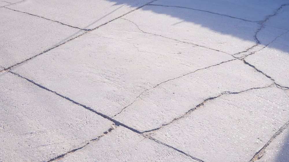 Image of cracked concrete that needs concrete repair