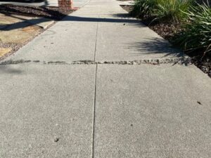 image of a sidewalk in need of polyjacking