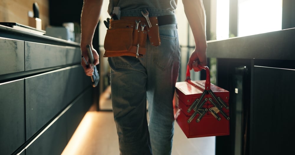 home maintenance checklist - image of a man with tools